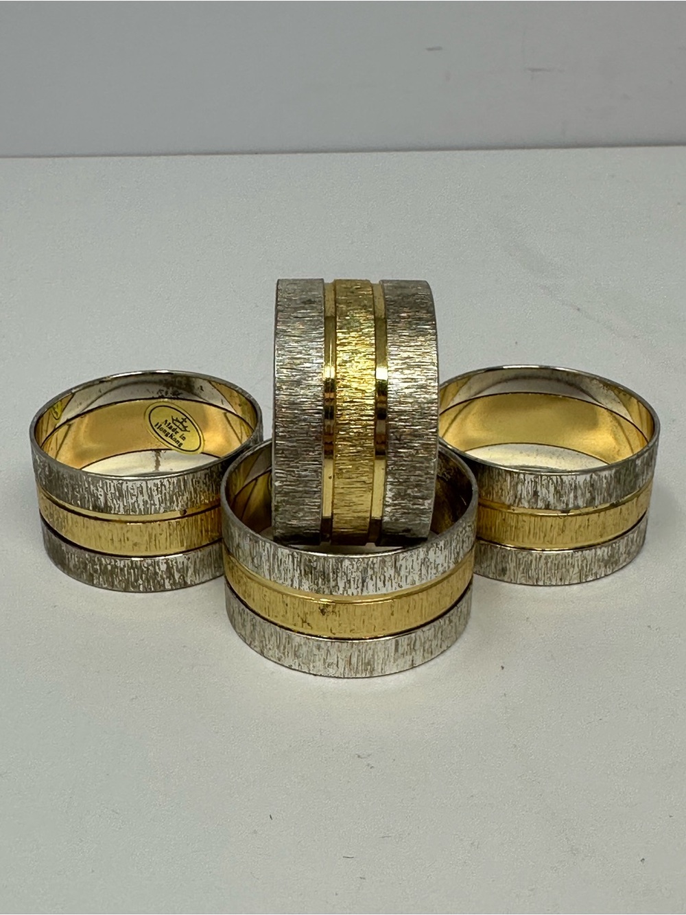 Vintage Set of 4 Two-Tone Gold and Silver Metal Napkin Rings Made in Hong Kong